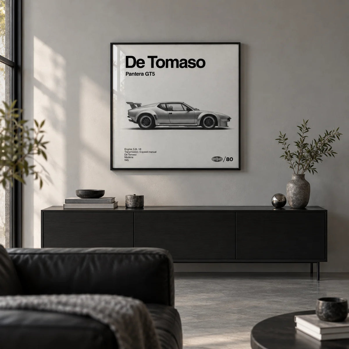 1970s Wedge Sports Car Poster, framed on the wall of a design-led city flat living room with a soft grey wall and a concrete floor