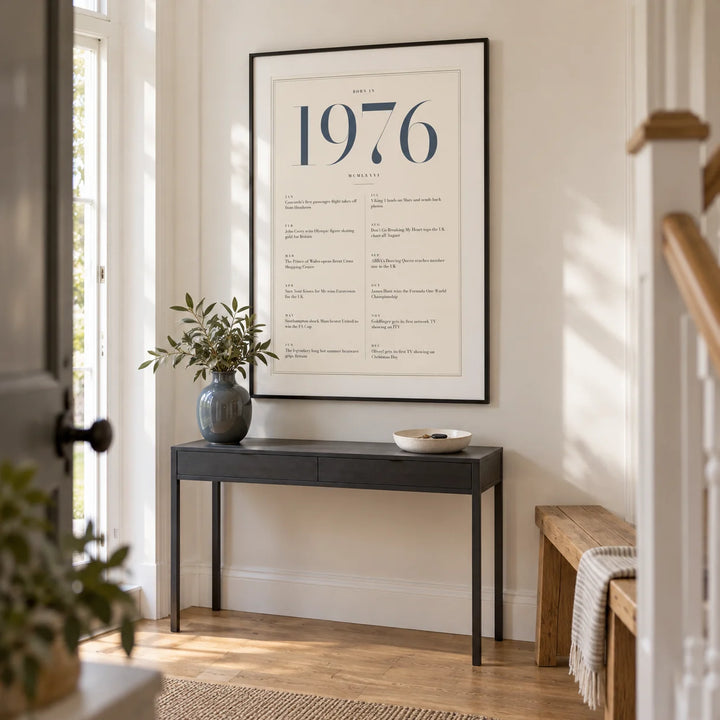 1976 Blue Birthday Print, framed on the wall of a bright entrance hallway in a renovated UK semi-detached home with warm white walls and an oak floor