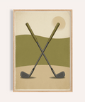 Framed-style wall art print of two crossed golf clubs over layered hills