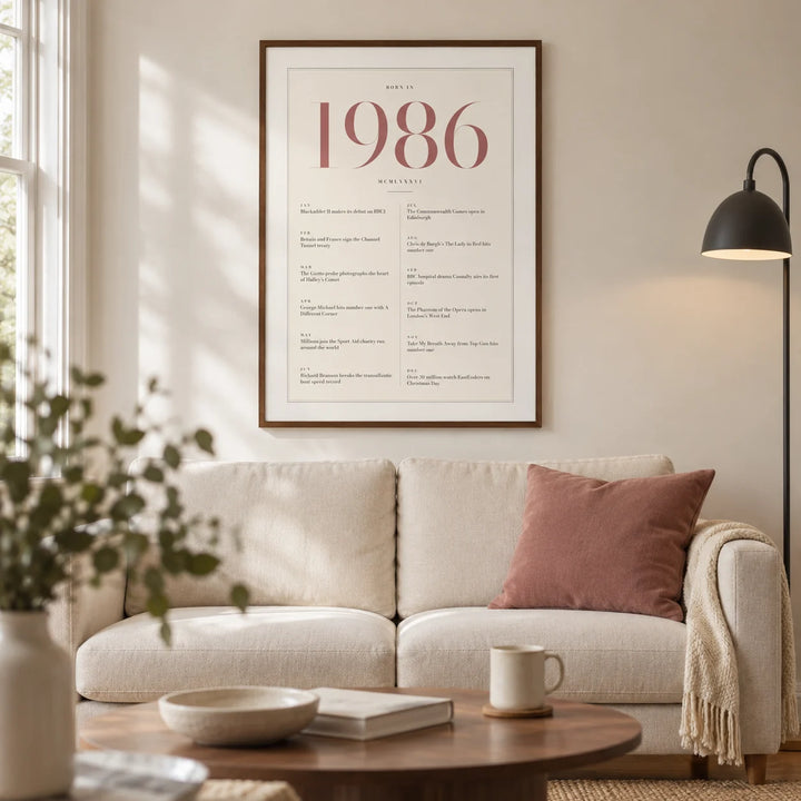 1986 Pink Birthday Print, framed on the wall of a refined modern living room in a UK terraced home with warm white walls and an oak floor