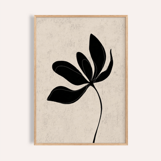 Framed minimalist botanical wall art with black leaf silhouette on textured beige background
