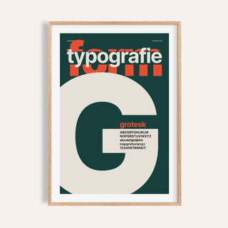 Giant letter G typography print shown on a plain warm wall