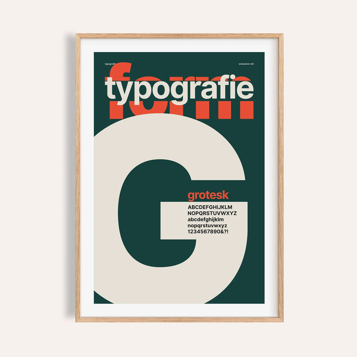 Giant letter G typography print shown on a plain warm wall
