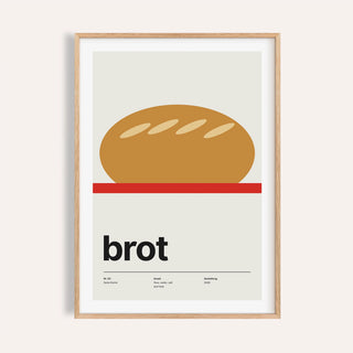 Scored loaf on a red board print shown on a plain warm wall