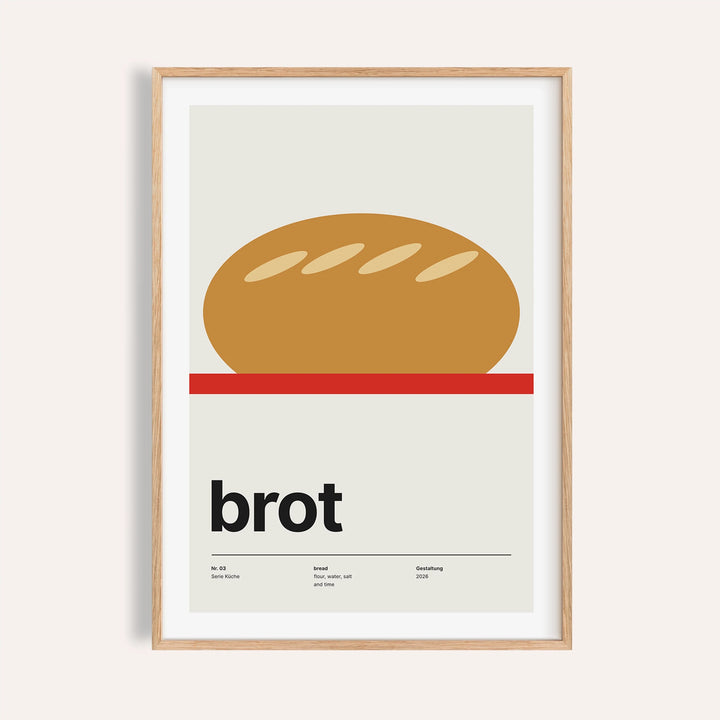 Scored loaf on a red board print shown on a plain warm wall