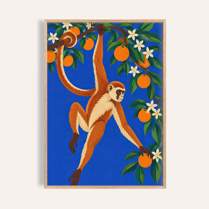 Monkey wall art with a monkey hanging from an orange tree on cobalt blue