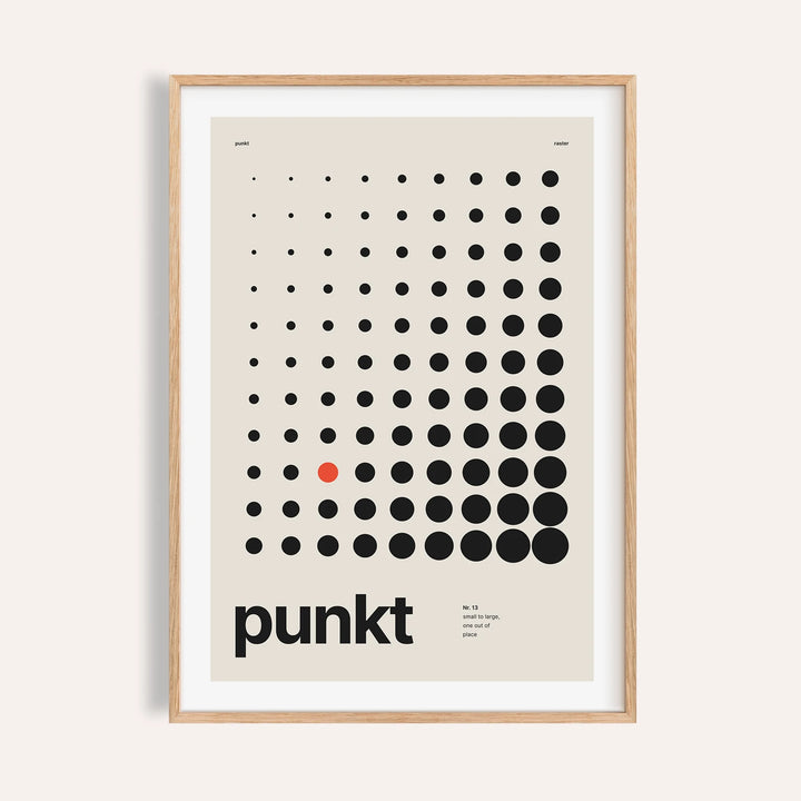 Halftone dot grid print shown on a plain warm wall