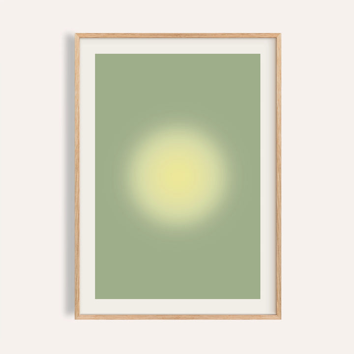 Butter yellow wall art with a glowing yellow orb on soft sage green
