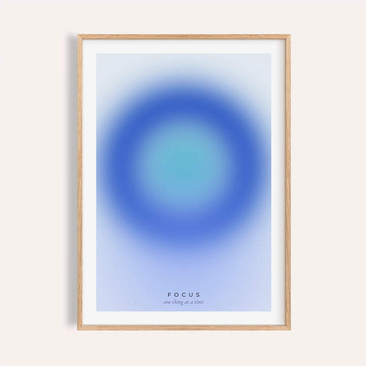 Deep blue and turquoise focus print shown on a plain warm wall