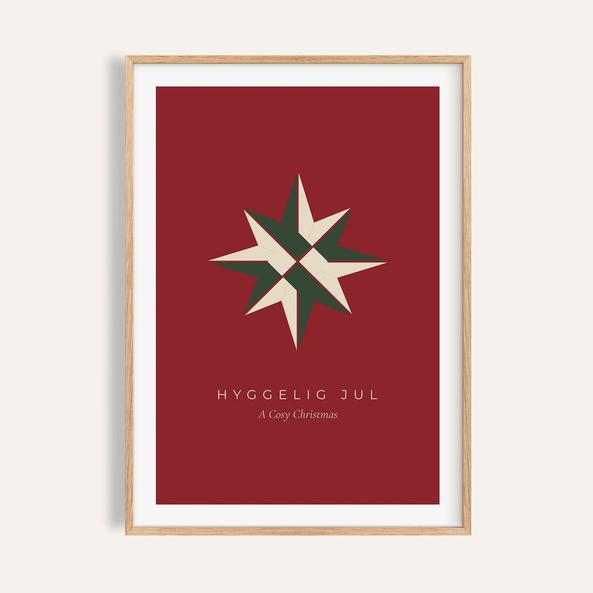 Red paper star Christmas print shown on a plain warm wall