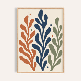 Seaweed print with three tall fronds shown on a plain warm wall