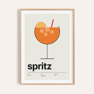 Orange spritz in a balloon glass print shown on a plain warm wall