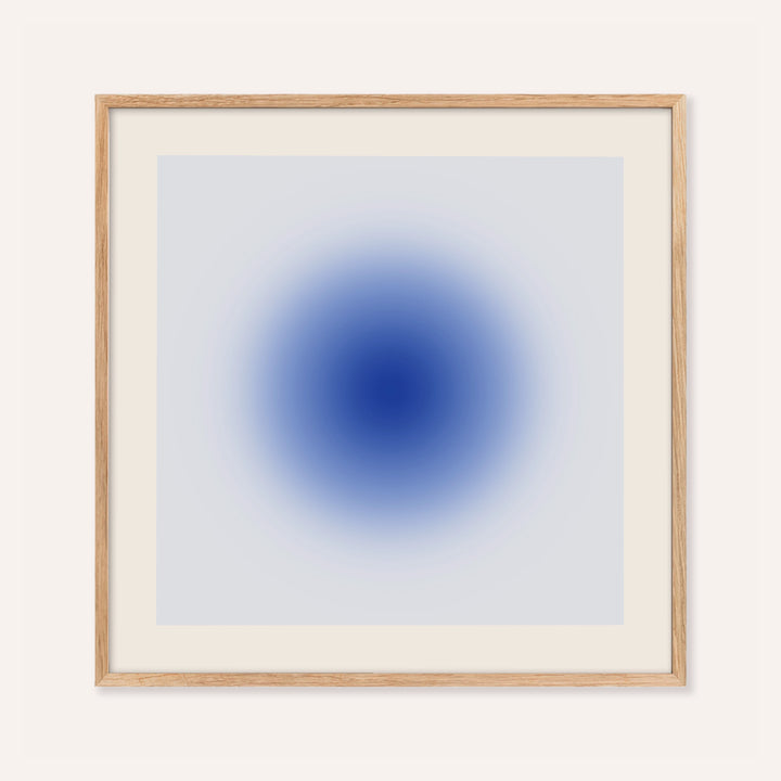 Cobalt blue wall art with a glowing cobalt orb on a pale ice blue square