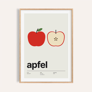 Whole and halved apple print shown on a plain warm wall