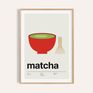 Red bowl of green matcha print shown on a plain warm wall
