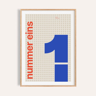 Giant cobalt number 1 print shown on a plain warm wall