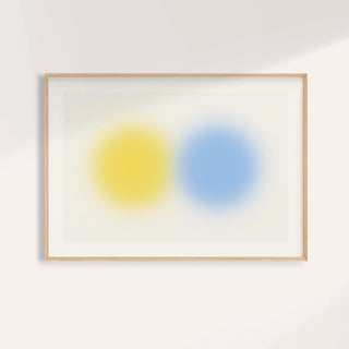 Abstract minimal print with a lemon yellow orb beside a sky blue orb