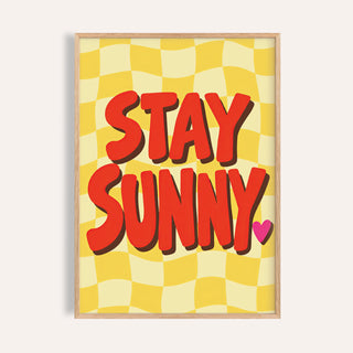 Sunshine print reading STAY SUNNY in red letters on a yellow checkerboard