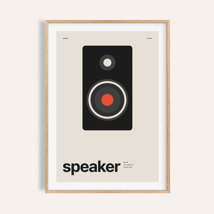 Black studio monitor speaker print shown on a plain warm wall