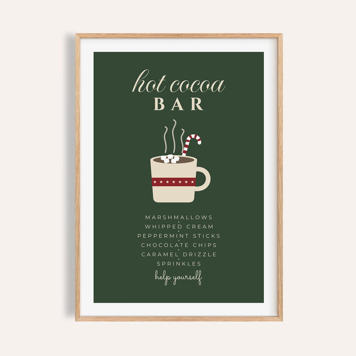Green hot cocoa bar sign print shown on a plain warm wall