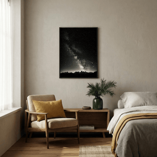 Crisp black and white astrophotography poster with speckled starlight and off-center galactic core