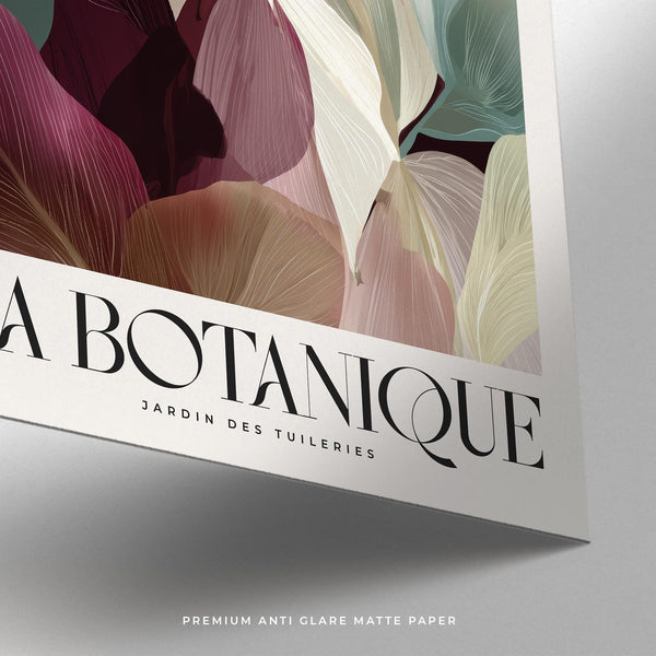 Burgundy wall art featuring green and ivory leaves