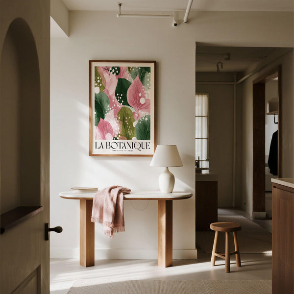 Framed floral abstract print hanging in a modern living room with neutral decor.