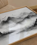 Mist-filled mountain valley with flying birds, black and white landscape print.
