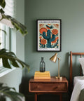 Colorful cactus wall art with bold lines and rich earthy tones.
