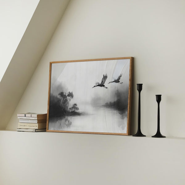 Japanese cranes flying art showing reflected trees and a quiet lake horizon.