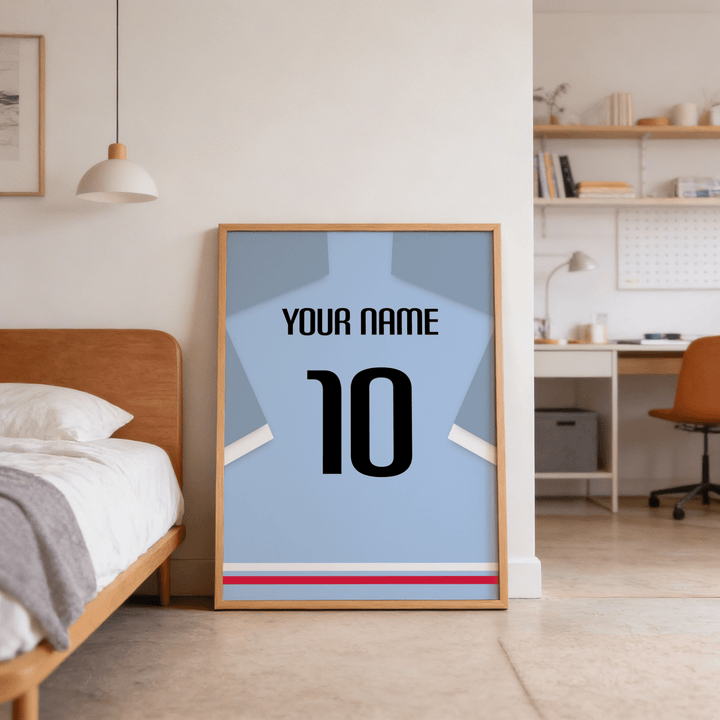 Football Shirt Poster in Light Blue with Black Number leaning on floor next to wooden bed