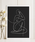 Minimalist Human Form Art Print depicting monochrome figure with folded legs