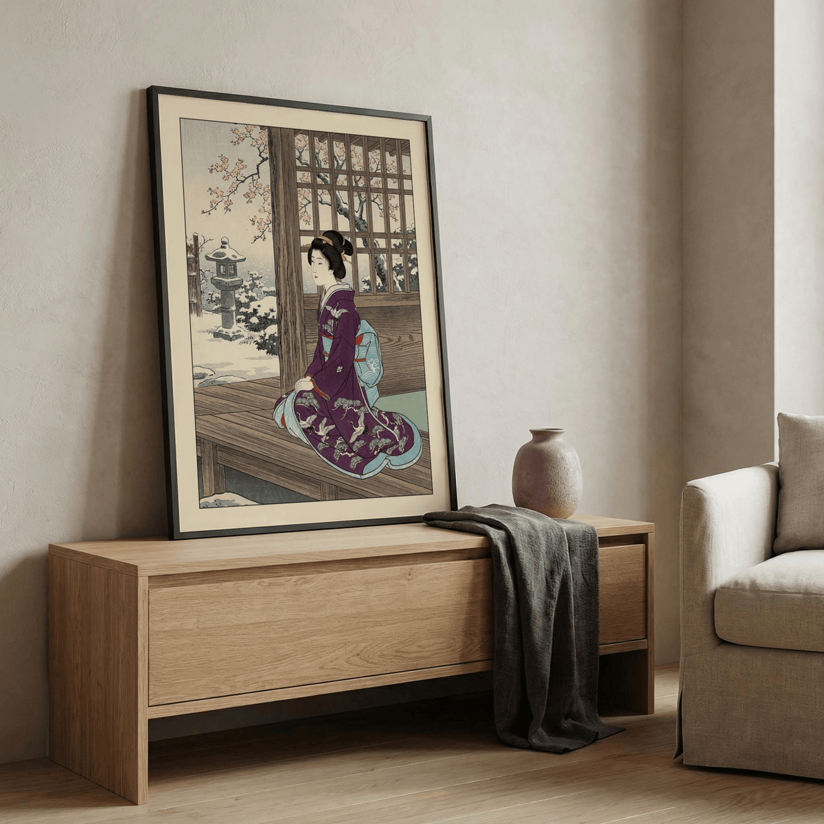 Print of kimono-clad figure seated on porch with blossoms and architecture