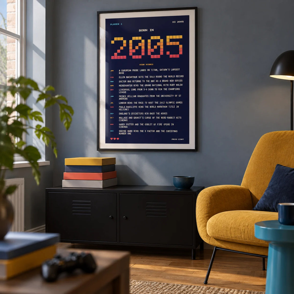 2005 Pixel Art Print, framed on the wall of a small retro-inspired games snug in a UK flat with a muted blue-grey wall in a living room