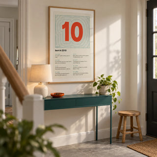 2010 Contour Map Print, framed on the wall of a welcoming contemporary hallway in a British semi-detached home with a warm white wall and plain grey stone floor