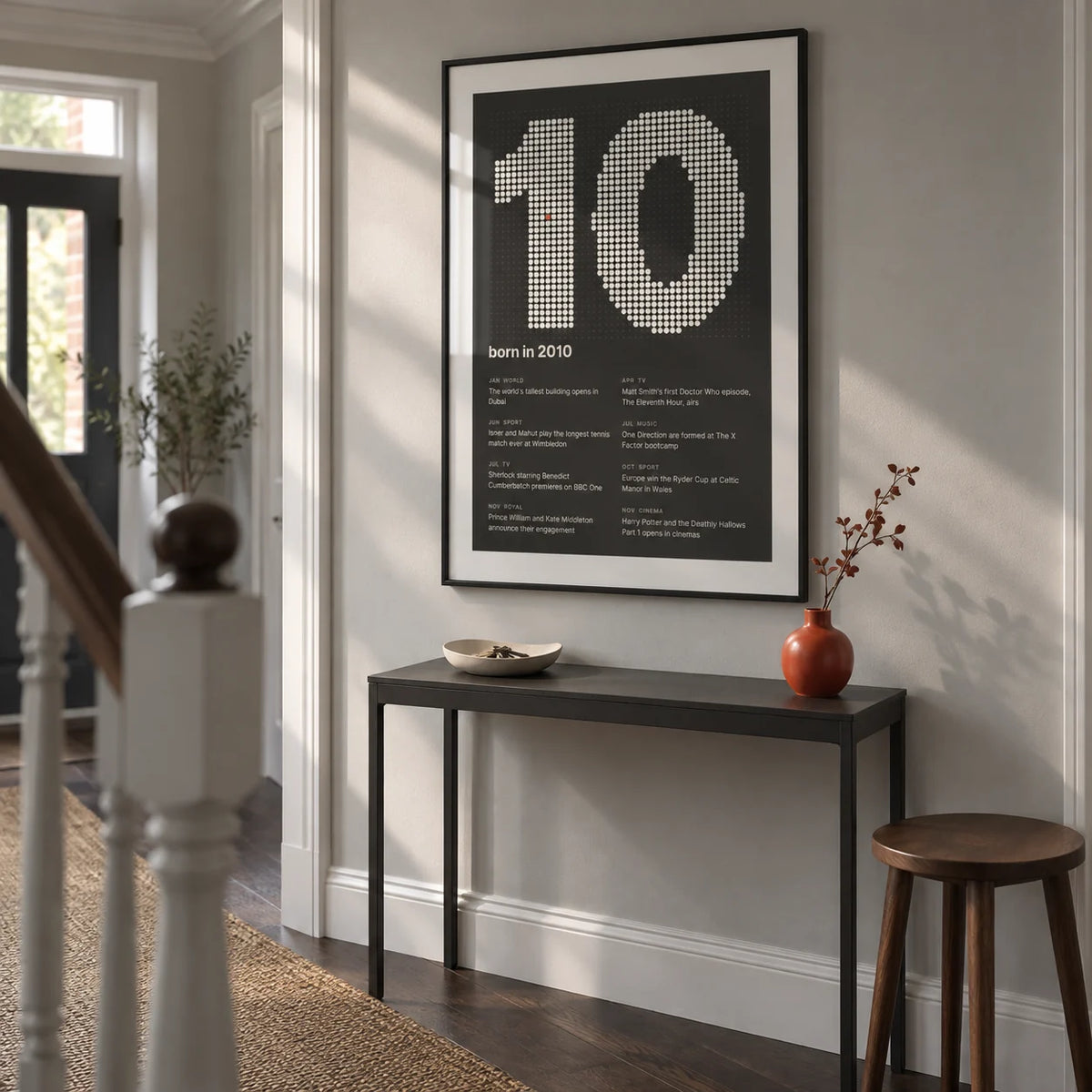 2010 Halftone Print, framed on the wall of a contemporary hallway in a UK terraced house with a pale grey wall and dark wood floor