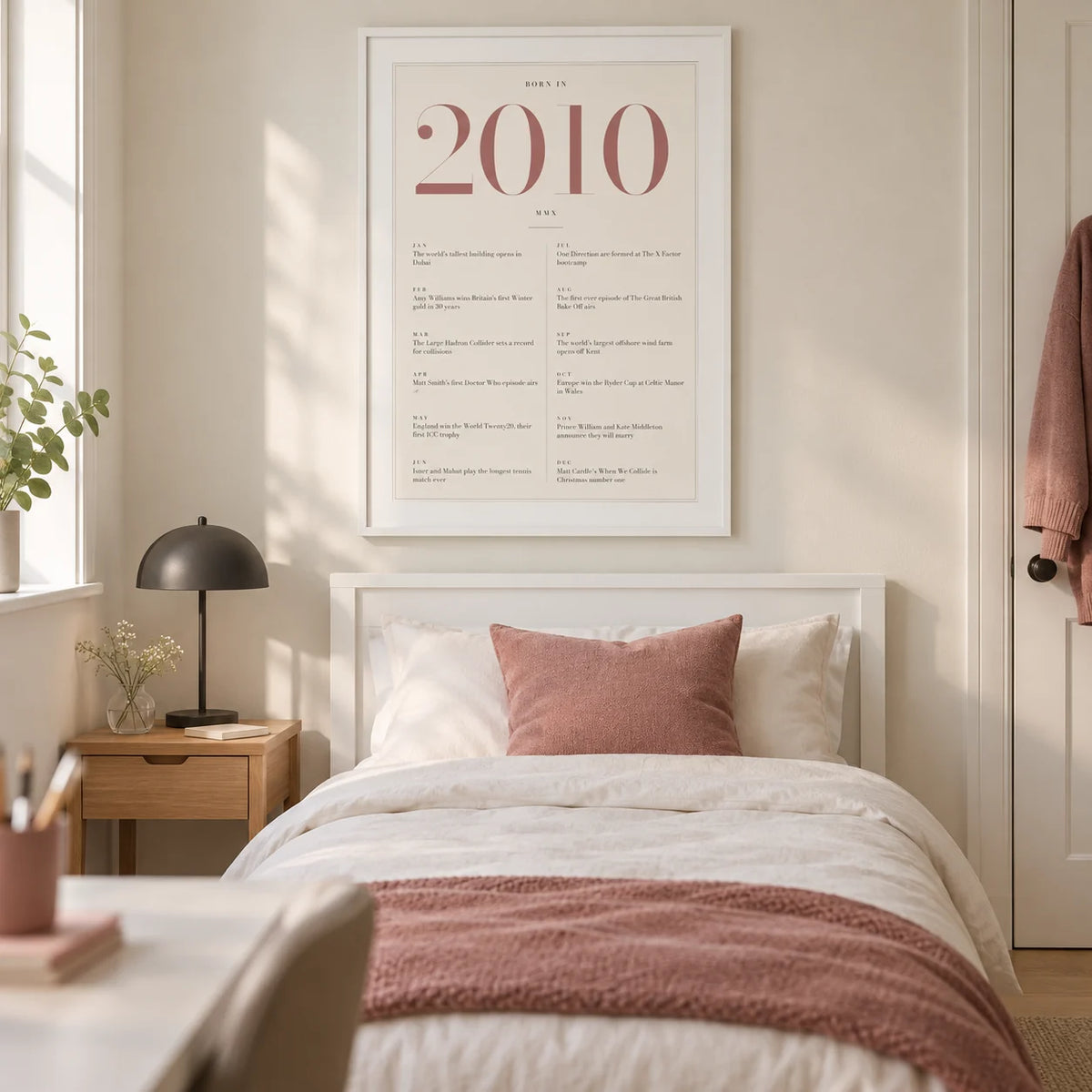 2010 Pink Birthday Print, framed on the wall of a tidy contemporary teenage girl's single bedroom (15-17) in a UK family home with an ivory wall and pale oak floor