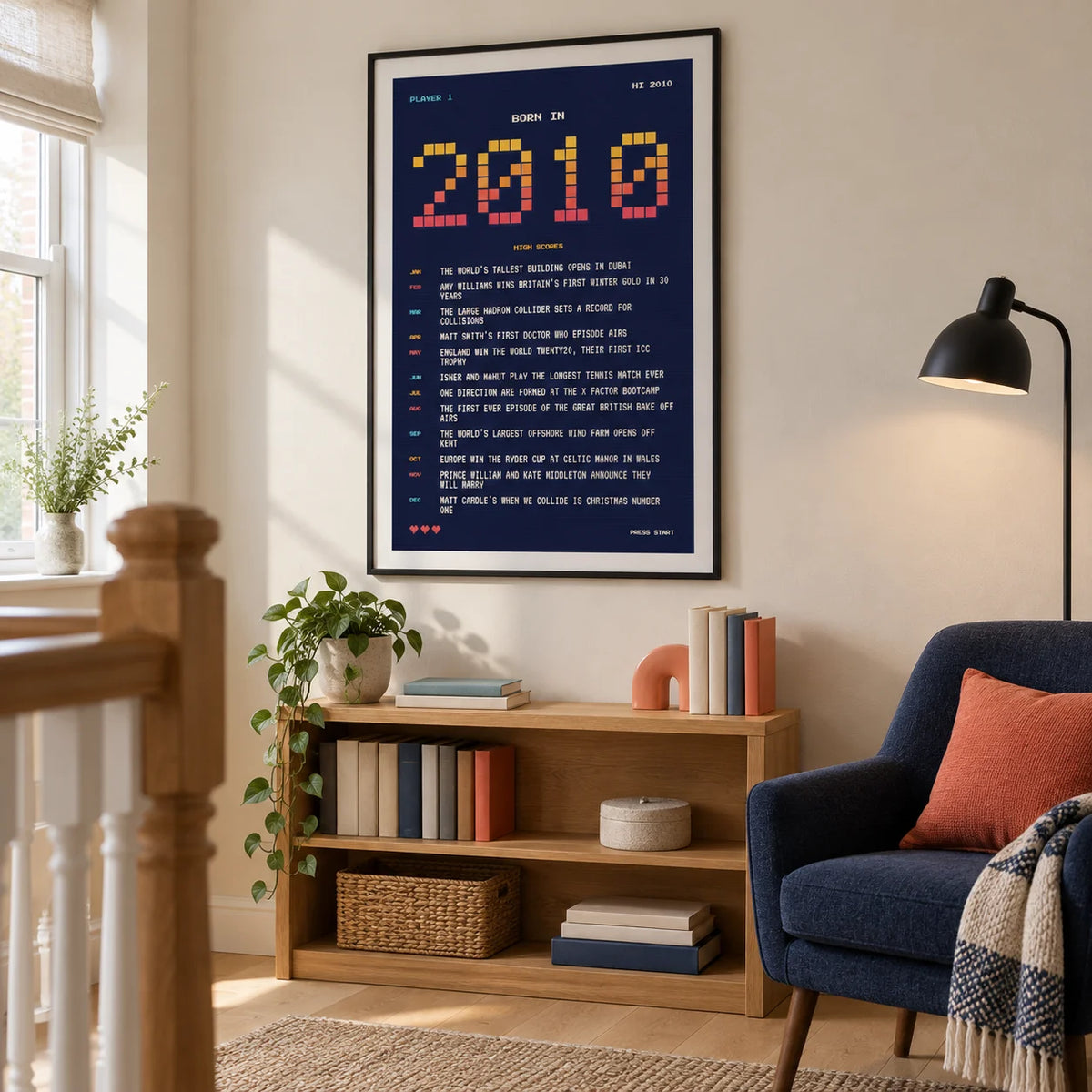 2010 Pixel Art Print, framed on the wall of a wide upstairs landing used as a reading nook in a UK family home in a living room