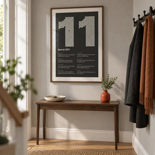 2011 Halftone Print, framed on the wall of a clean contemporary hallway in a British family home with a pale grey wall and oak floorboards