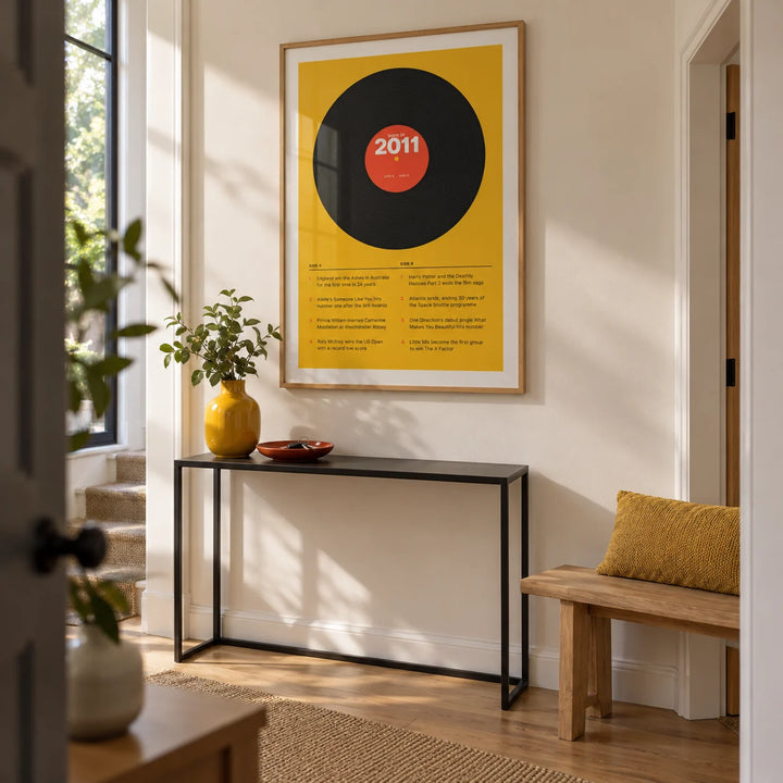 2011 Vinyl Record Print, framed on the wall of a bright contemporary hallway in a UK family home with a warm white wall and plain oak flooring