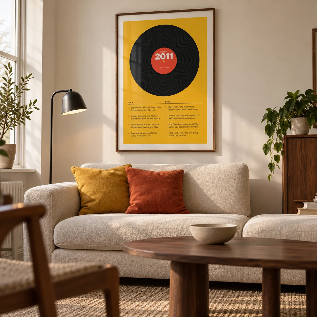 2011 Vinyl Record Print, framed on the wall of a design-led living room in a British terraced house with a cream wall and walnut furniture