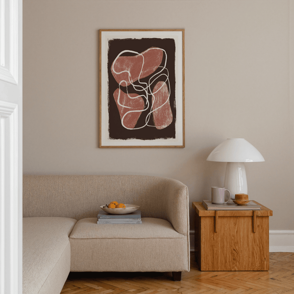 Close-up of abstract wall art print showing chalky texture on red shapes and white drawn line