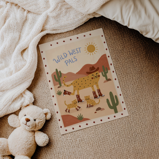 Decorative kids wall print with cheetah family, cactus plants, and sun over rolling hills