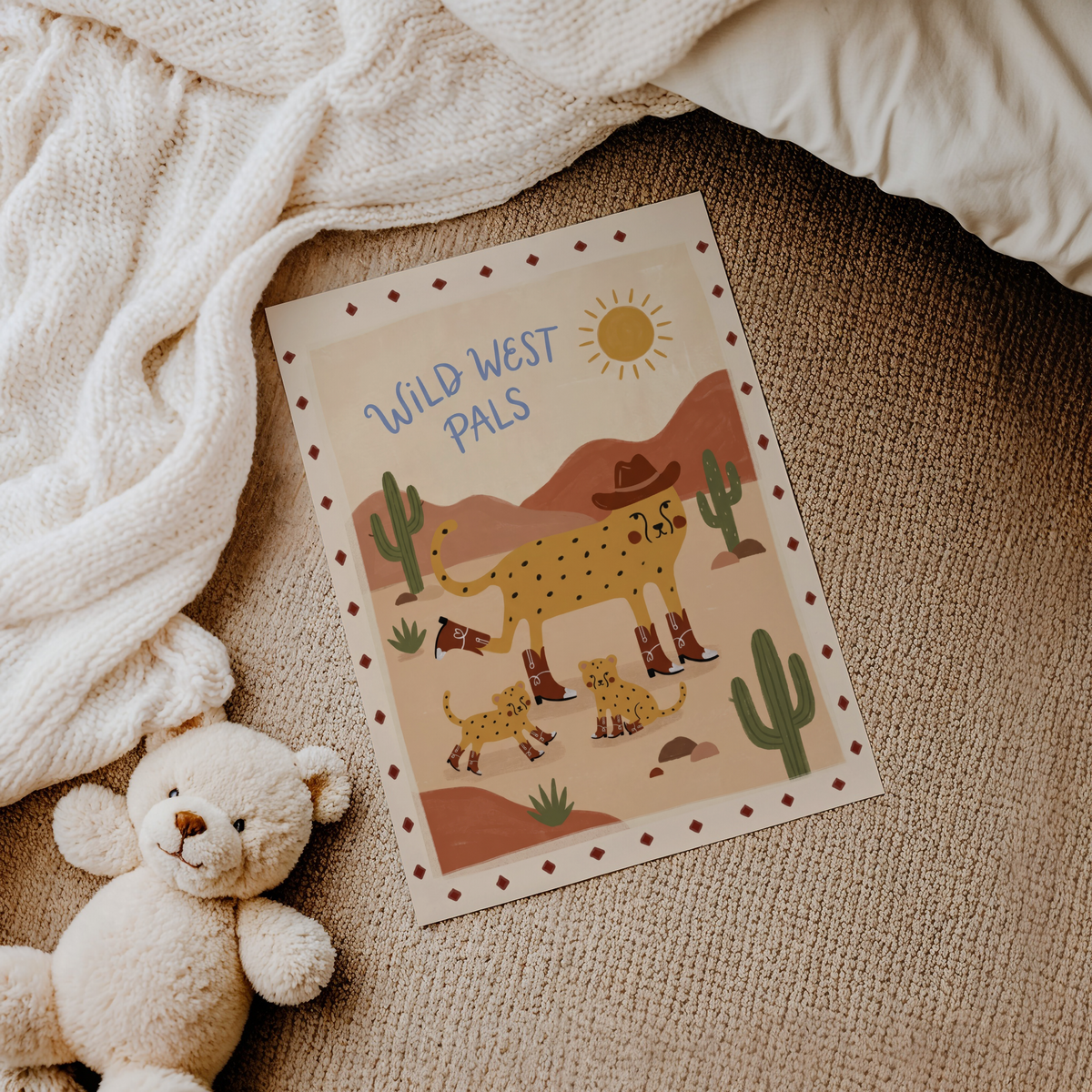 Decorative kids wall print with cheetah family, cactus plants, and sun over rolling hills