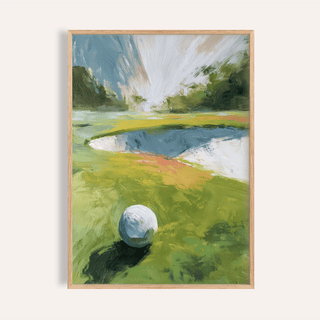 Framed golf landscape wall art featuring a golf ball on a green fairway with abstract watercolour style