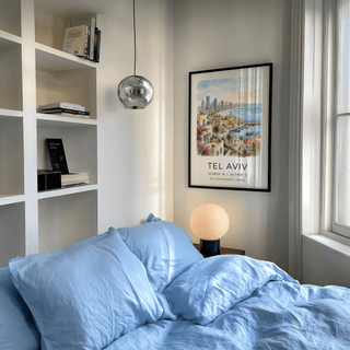 Illustrated cityscape poster showing Tel Aviv shoreline, high-rises, and old harbor buildings