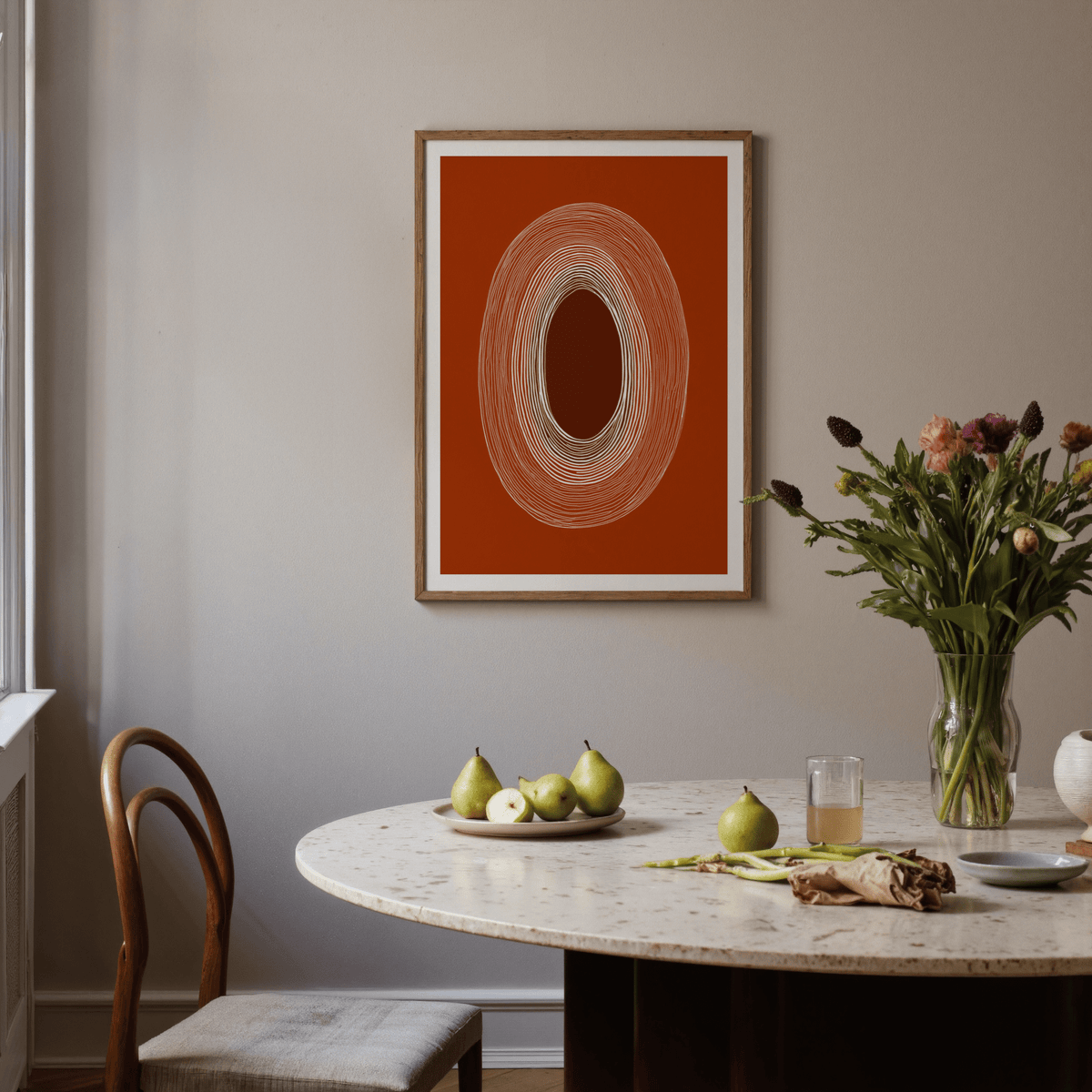 Graphic wall art print of repeated oval outlines over beige background