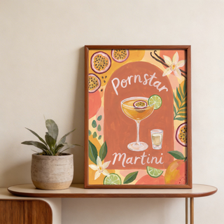 Highlighting a painted martini wall art print with central glass, citrus wedges, leafy sprigs, and floral accents