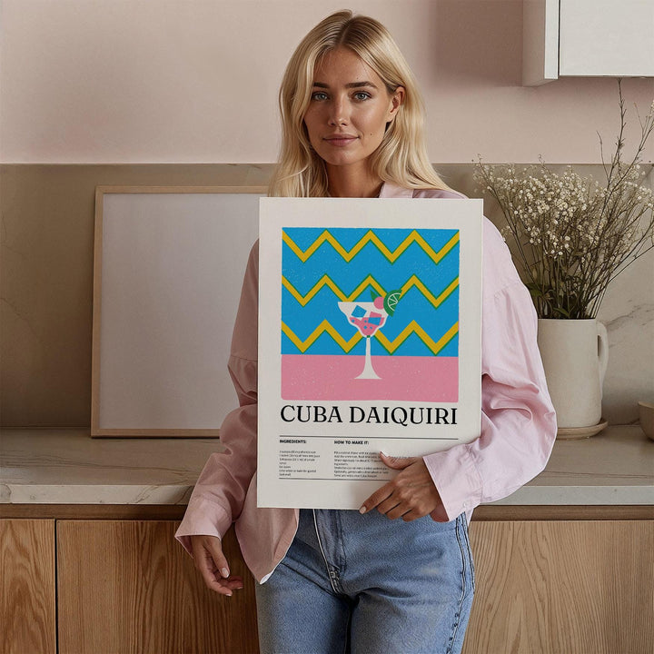 Framed Alcohol Artwork held by woman showing daiquiri cocktail with blue and yellow zigzag background