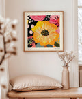 Yellow and pink flower wall art with modern accents.